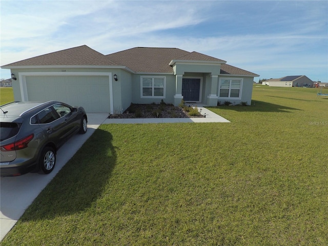 view of front of house featuring a garage, a front yard, concrete driveway, and stucco siding