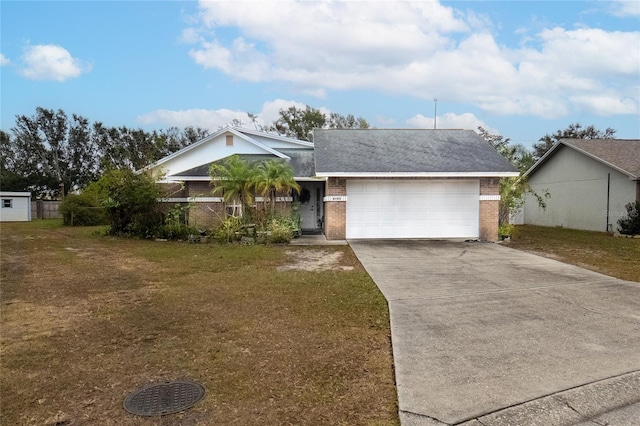 single story home with a front yard and a garage