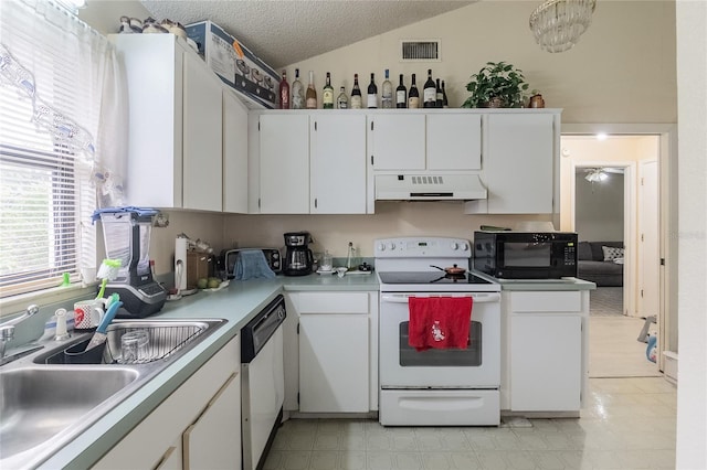 kitchen featuring white appliances, a textured ceiling, white cabinetry, sink, and range hood