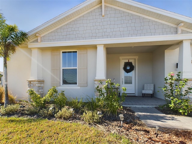 property entrance featuring covered porch