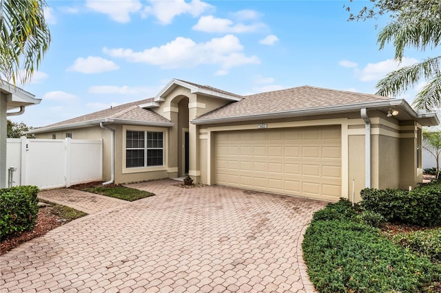 single story home featuring a garage