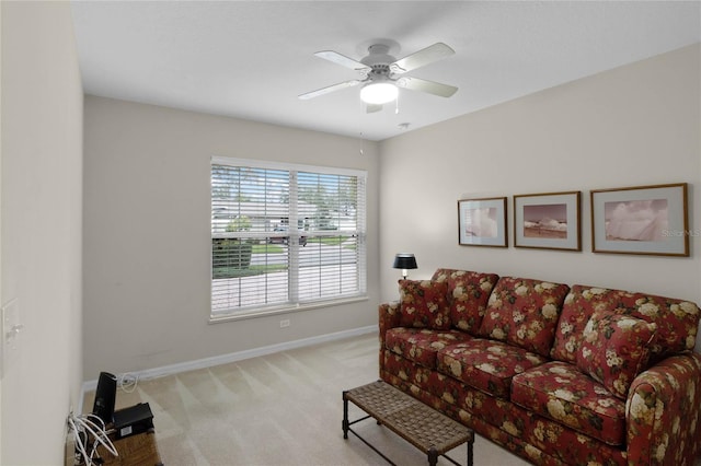 carpeted living room featuring ceiling fan