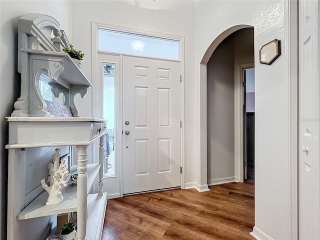 entryway with hardwood / wood-style floors