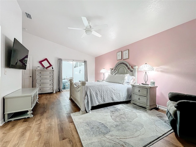 bedroom with light hardwood / wood-style flooring, ceiling fan, and lofted ceiling