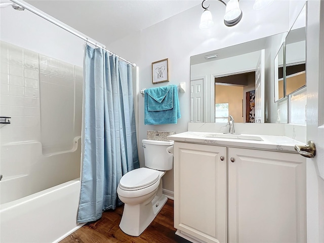 full bathroom with hardwood / wood-style flooring, vanity, toilet, and shower / bathtub combination with curtain