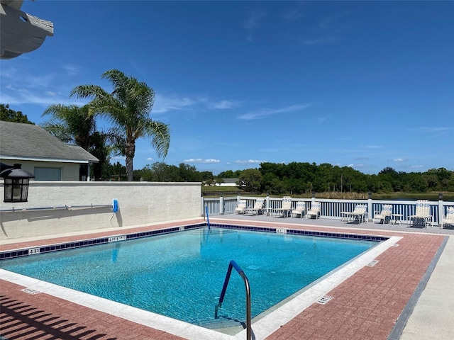 view of swimming pool with a patio