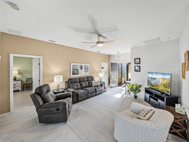 living room featuring ceiling fan