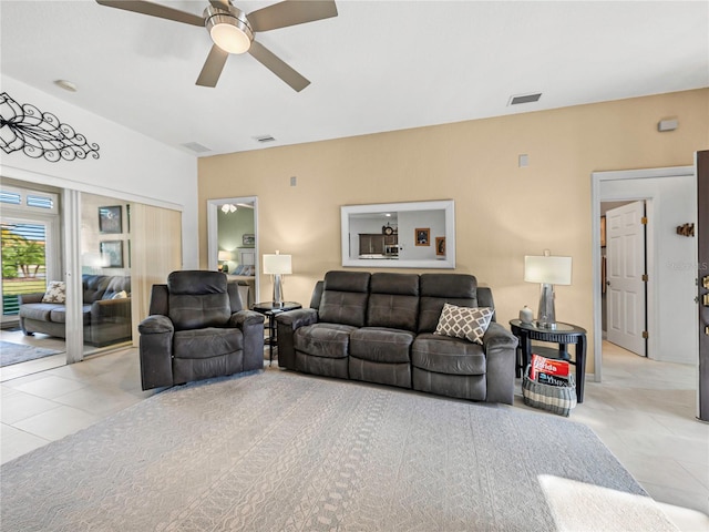 living room with ceiling fan and light tile patterned floors