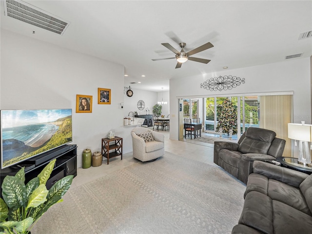 living room featuring ceiling fan and light tile patterned floors