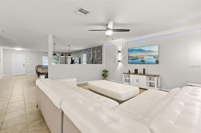 living room featuring billiards, ceiling fan, and light tile patterned flooring