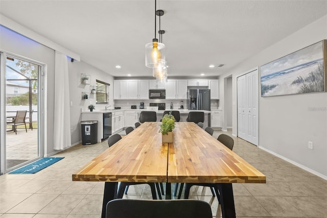 tiled dining area with sink