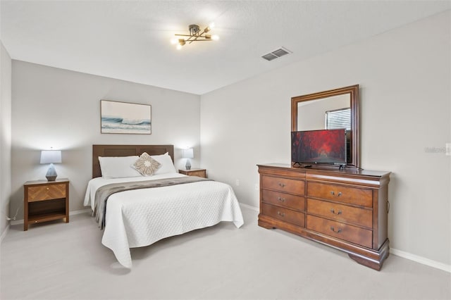 bedroom featuring light carpet