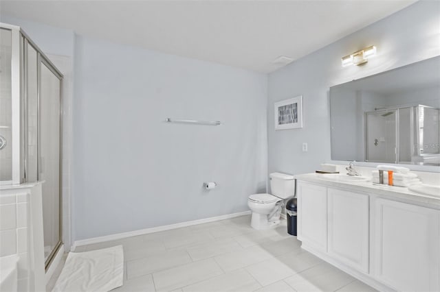 bathroom with tile patterned flooring, vanity, toilet, and a shower with door