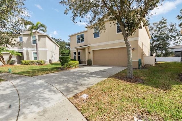 view of front of home with a front yard and a garage