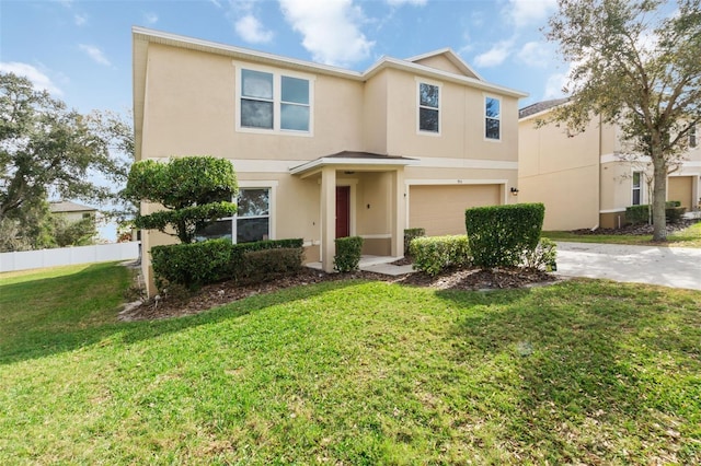 view of front of property with a garage and a front lawn