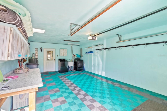 garage with sink and a garage door opener