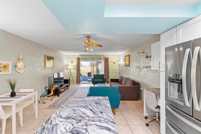 tiled living room with ceiling fan