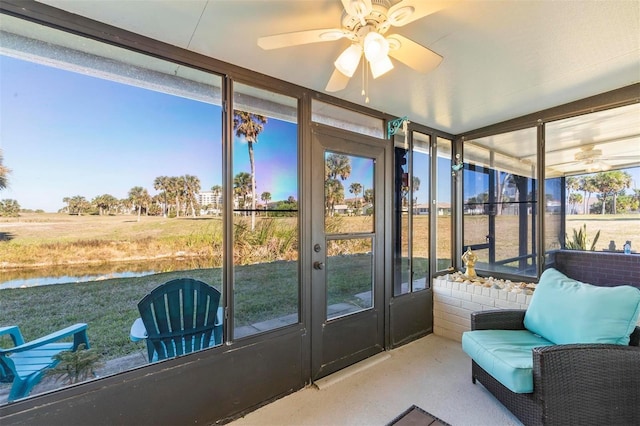 sunroom / solarium featuring ceiling fan