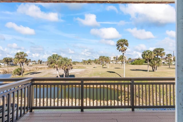 wooden deck featuring a water view