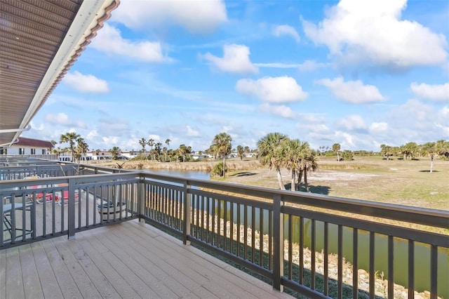 wooden deck featuring a water view