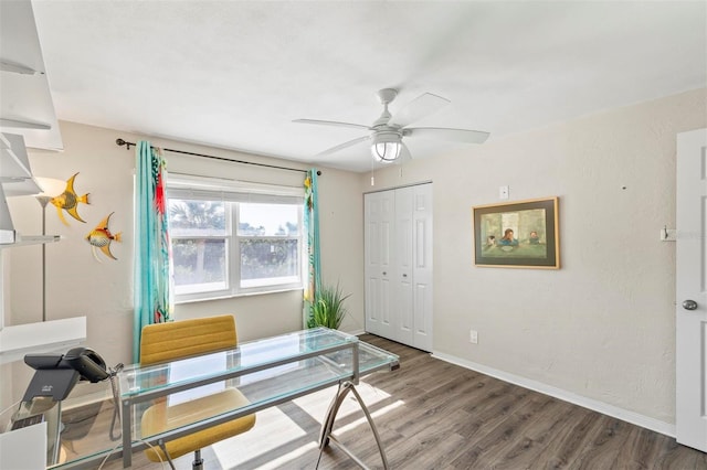 office space featuring ceiling fan and wood-type flooring