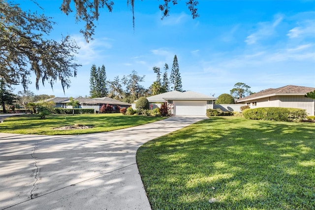 ranch-style home featuring a garage and a front lawn