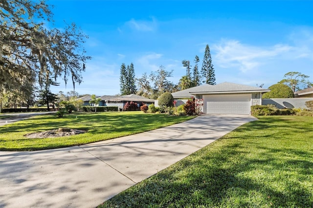 ranch-style house featuring a front lawn and a garage