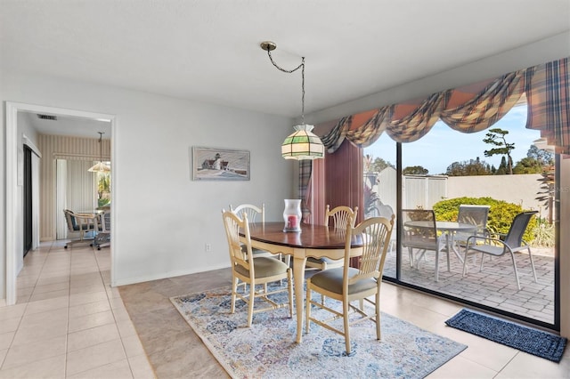 dining space featuring light tile patterned floors