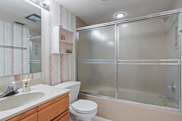 full bathroom with a textured ceiling, vanity, toilet, and enclosed tub / shower combo