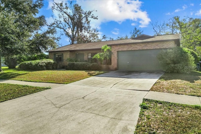 ranch-style home featuring a garage and a front yard