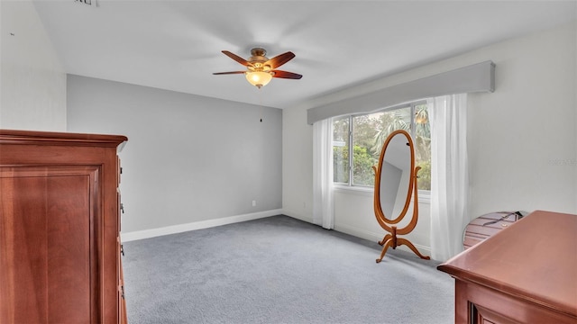 miscellaneous room featuring light colored carpet and ceiling fan