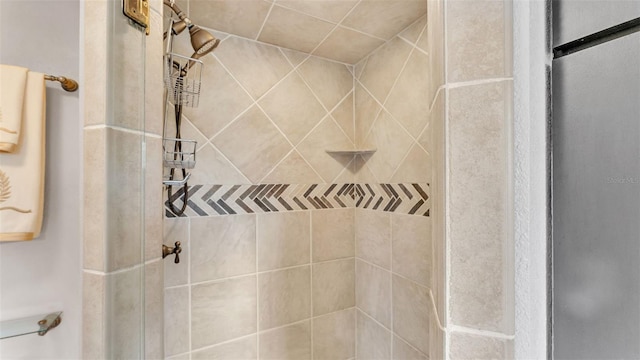 bathroom with tiled shower