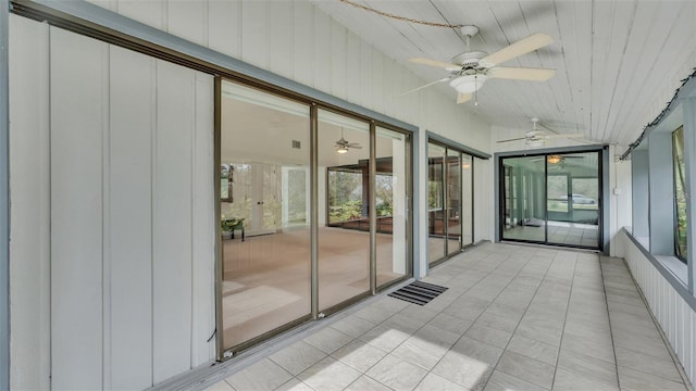 unfurnished sunroom featuring lofted ceiling