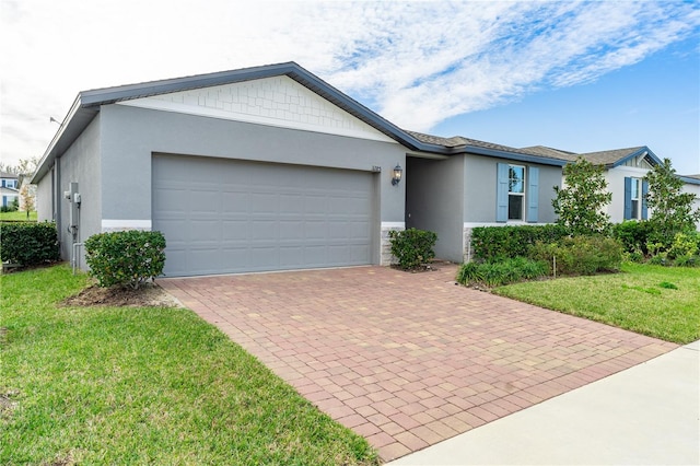 ranch-style home with a front yard and a garage