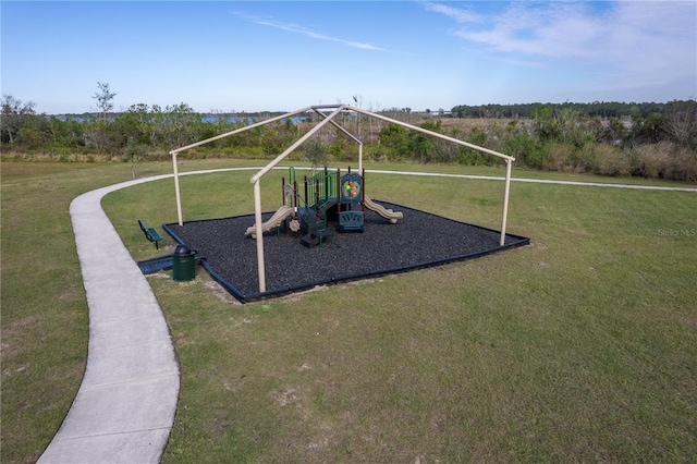 view of jungle gym with a lawn