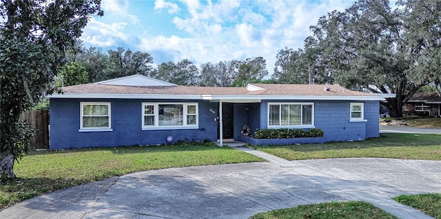 ranch-style house with a front yard