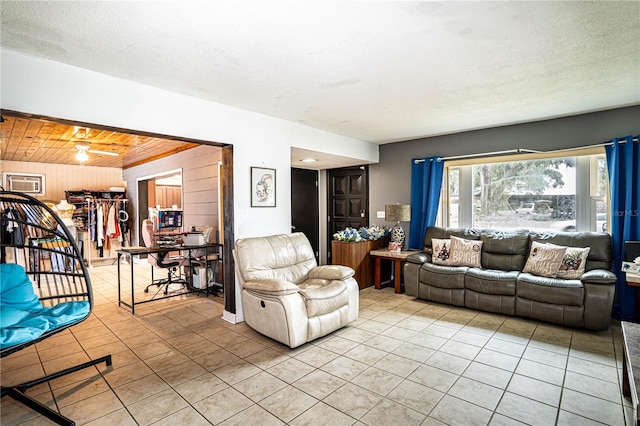 living room featuring wood ceiling, wood walls, and light tile patterned flooring