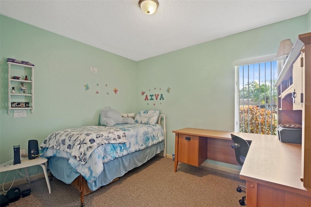 carpeted bedroom featuring a textured ceiling