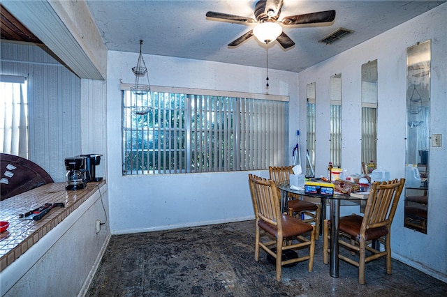 dining space featuring ceiling fan