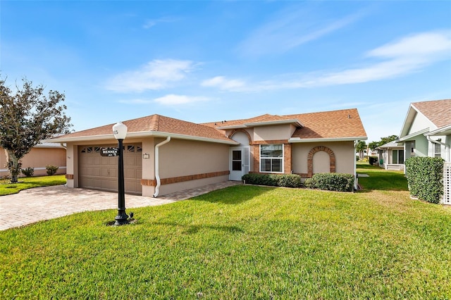 view of front of house with a front lawn and a garage