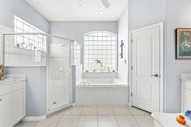 bathroom featuring ceiling fan, tile patterned flooring, vanity, and shower with separate bathtub