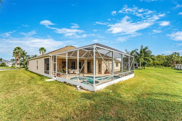 back of property featuring a lanai and a yard