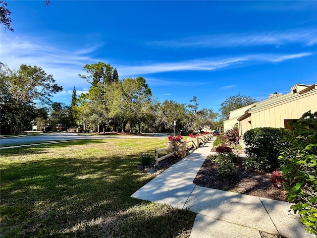 view of community featuring a yard