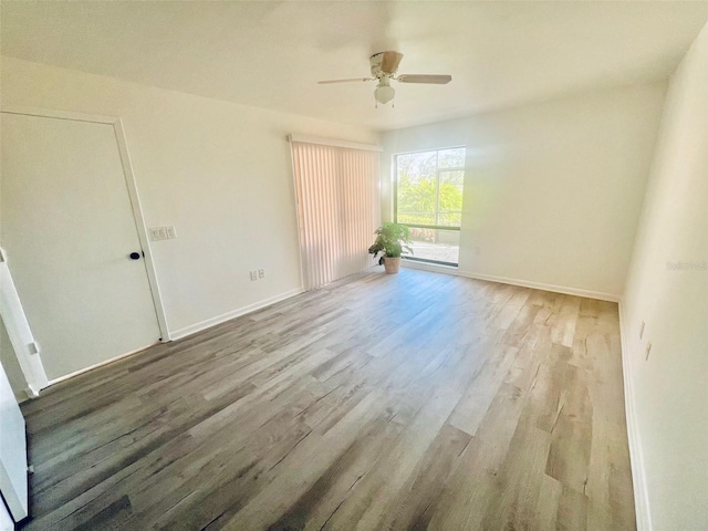 unfurnished room with light wood-type flooring and ceiling fan