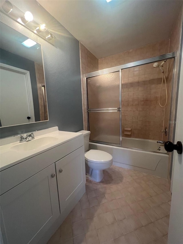 full bathroom featuring vanity, toilet, and enclosed tub / shower combo