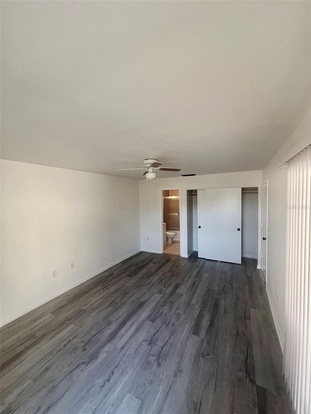 interior space featuring ceiling fan and dark hardwood / wood-style floors