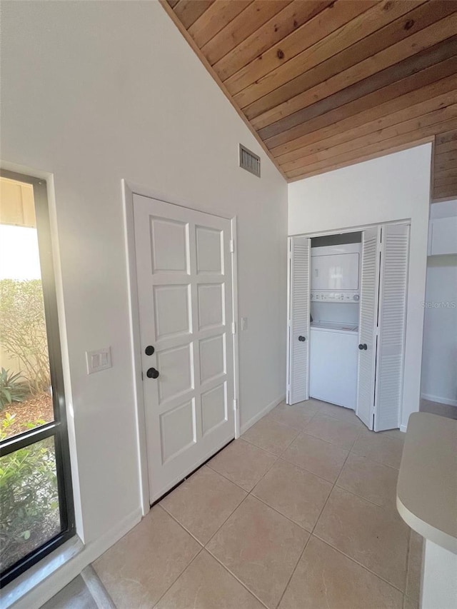 hallway with lofted ceiling, a wealth of natural light, and wooden ceiling