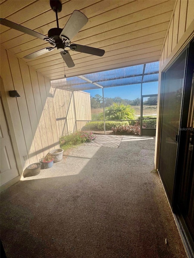 exterior space featuring ceiling fan