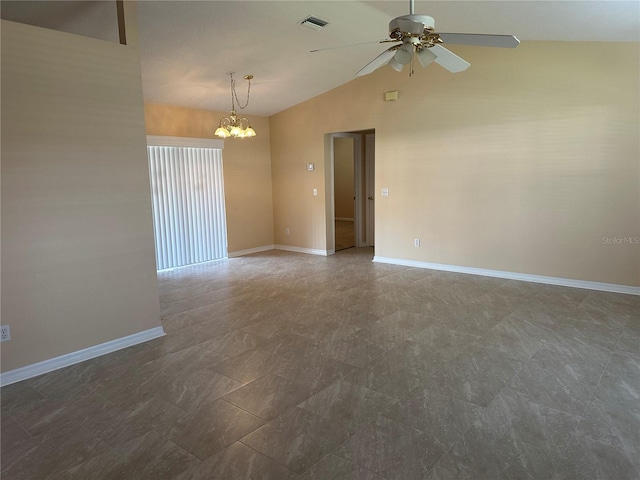 empty room featuring ceiling fan with notable chandelier and lofted ceiling