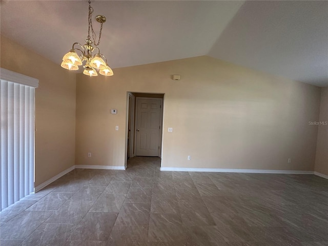 empty room with a notable chandelier and lofted ceiling